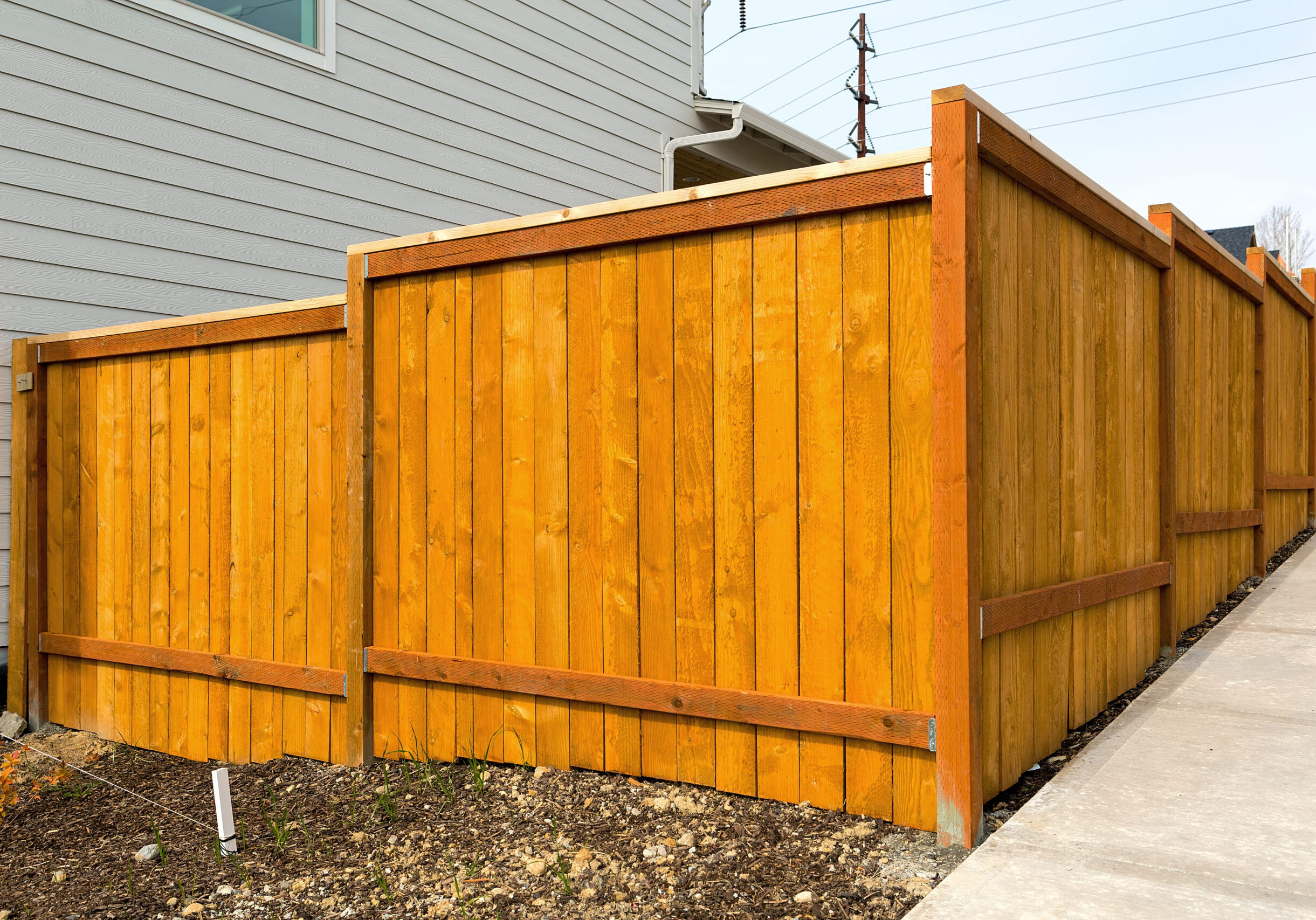 New home backyard wood fence construction